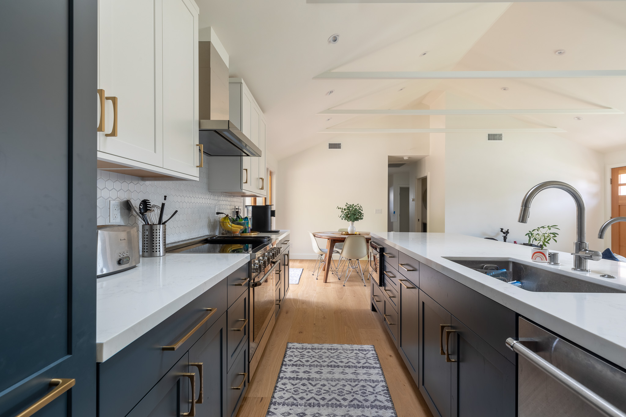 Culver City Living Room with Blue Cabinets, White Counter Top, and Real Wood Floors.
